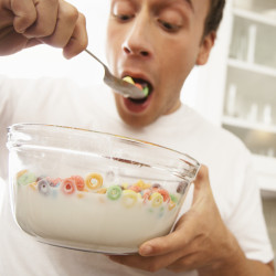Man Eating Large Bowl of Cereal